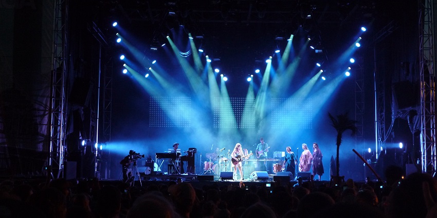 Quebec Music Festival, showcasing a lively crowd and stage at Parc Jean-Drapeau, Montreal.