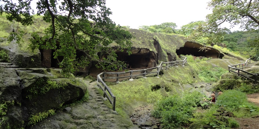 An image of the Kanheri Caves with the lush green nature view