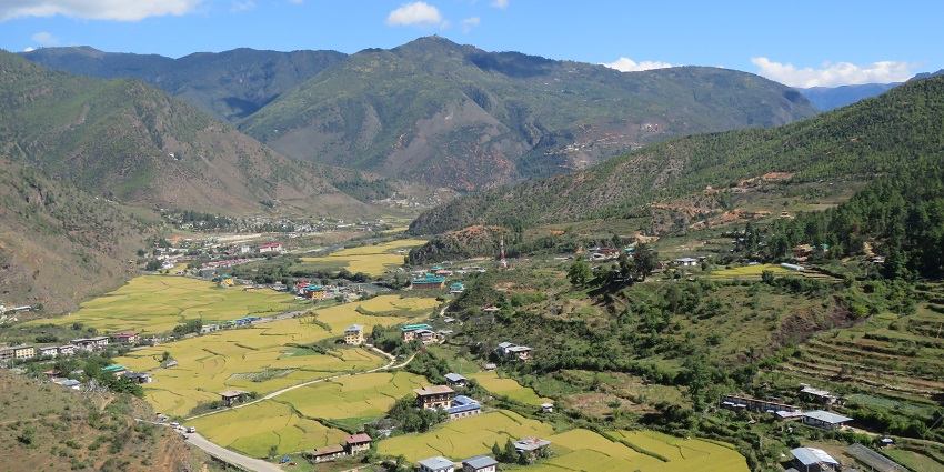 Aerial view of a Bhutan village with valleys surrounded under clear blue sky
Viewers of this file can see comments and suggestions