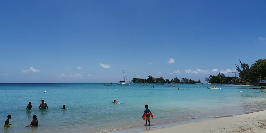 View of Pereybere Beach with people relaxing and enjoying.