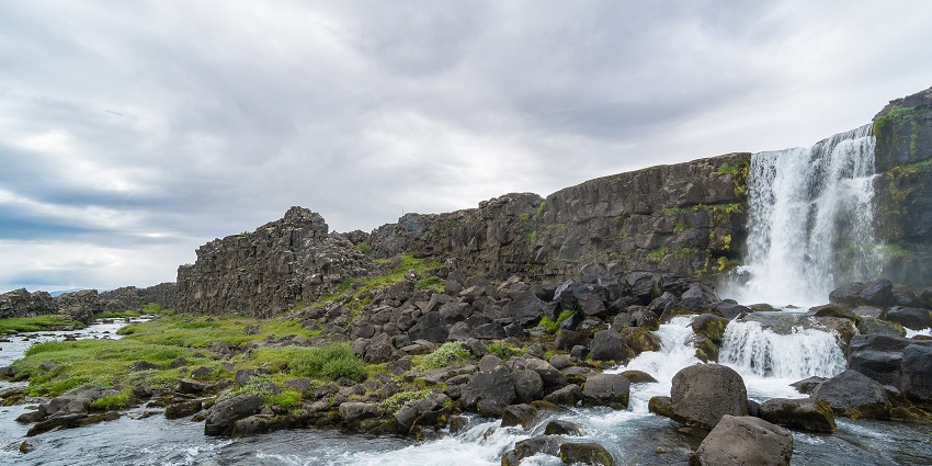 An image showing Öxarárfoss waterfall, a popular destination near Thingvellir National Park.
