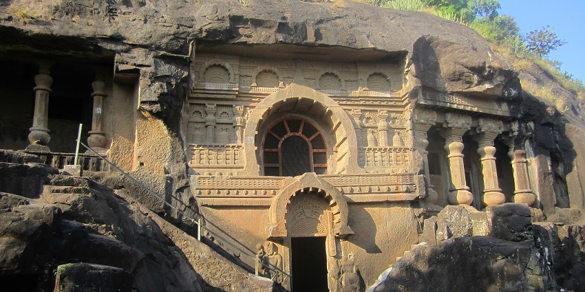 Rock-cut caves near Nashik with intricate ancient Buddhist carvings, featured in Nashik city guide.