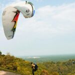 A man performing paragliding at a site in Sohna, a spot for paragliding in Gurgaon