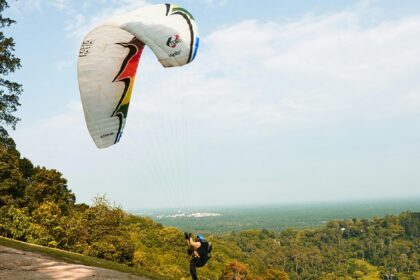 A man performing paragliding at a site in Sohna, a spot for paragliding in Gurgaon