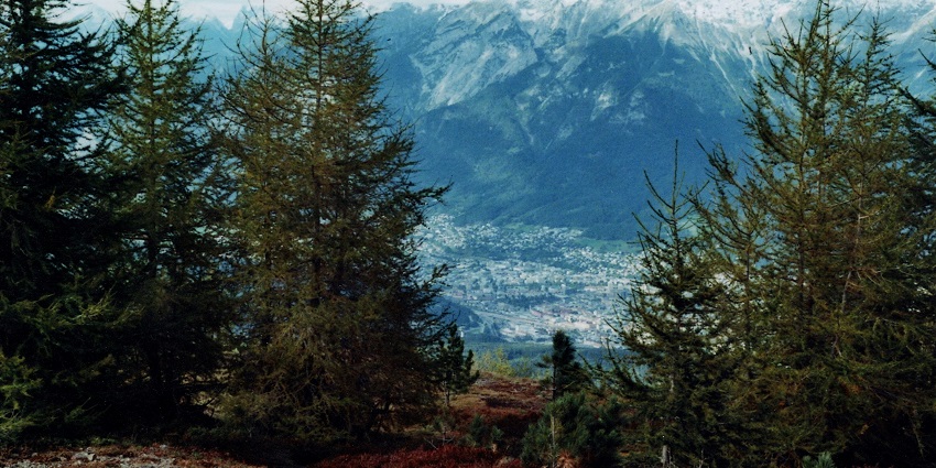 A panoramic view of Patscherkofel Mountain with hikers and stunning alpine scenery.