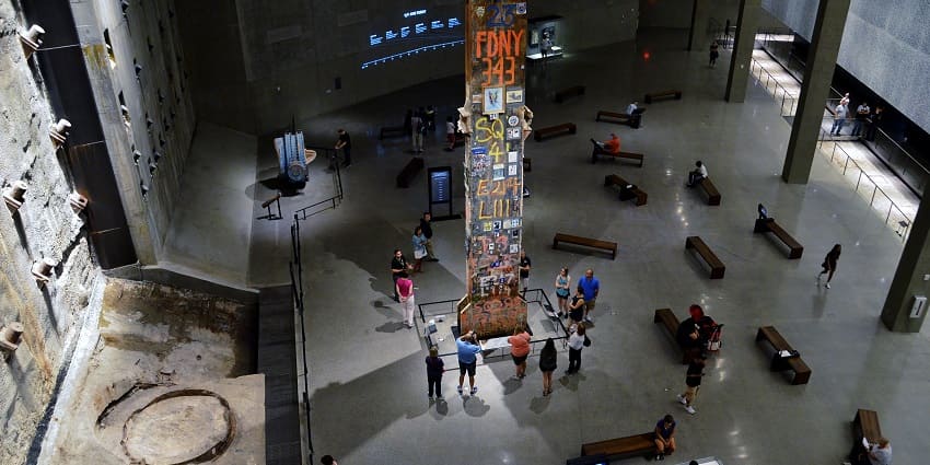 Interior of the 9/11 Memorial Museum with people exploring, one of the best things to see in New York.
