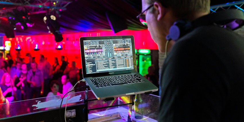A nightclub scene with people dancing on a packed floor enjoying the best Los Angeles nightlife.
