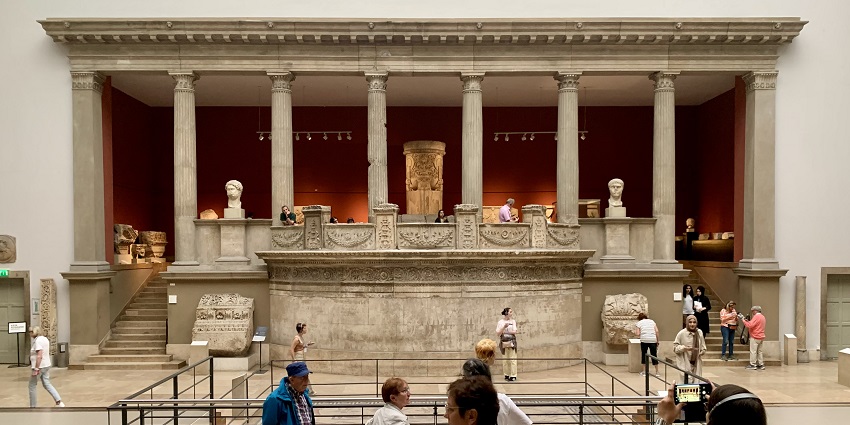 Inside the Pergamon Museum with people viewing and exploring the halls and exhibits