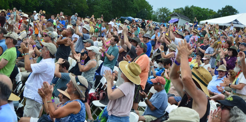 This picture shows the people enjoying the Philadelphia music festival, and folk music