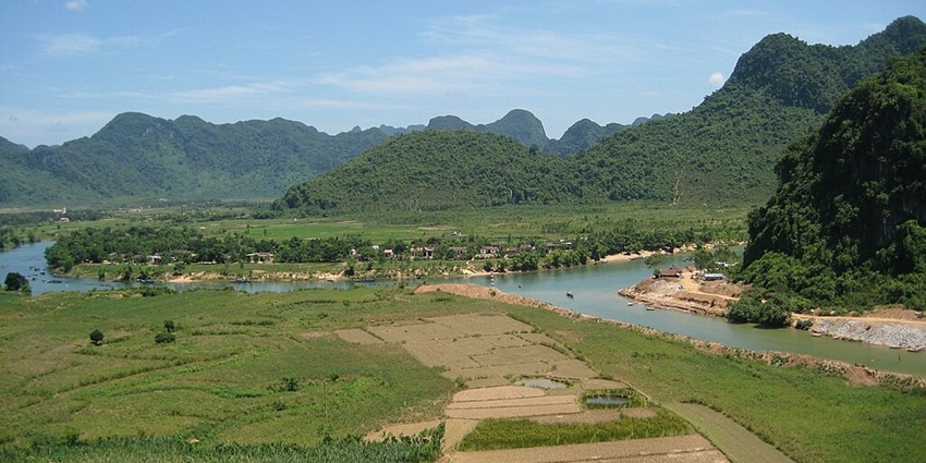 An aerial view of lush green fields of Phong Nha-Ke Bang National Park in Vietnam.