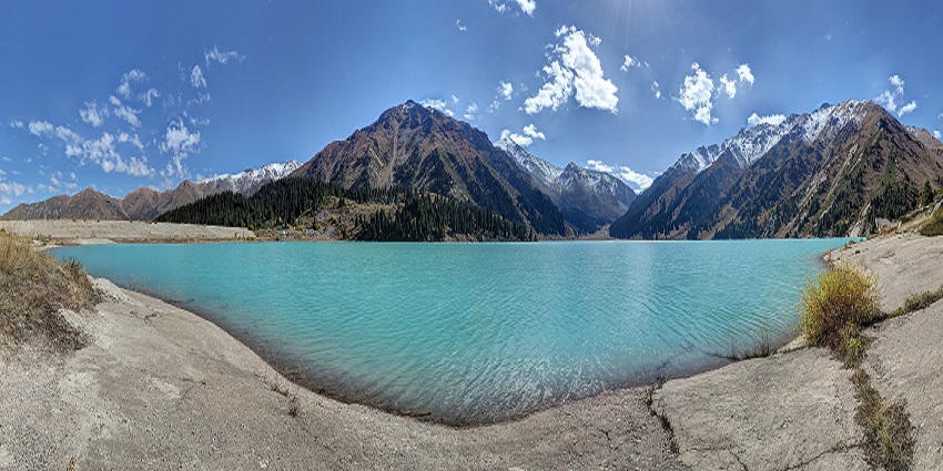 Stunning Almaty Lake - a turquoise alpine lake nestled in picturesque mountain scenery.