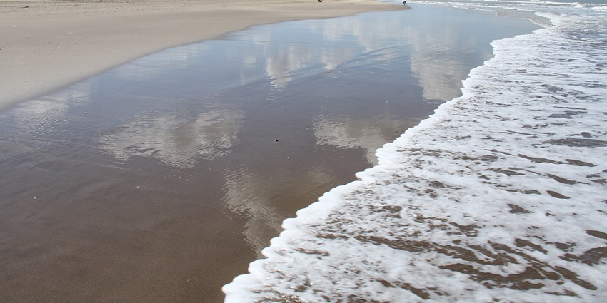 Most serene beach in Argentina with tall sand dunes and windy weather