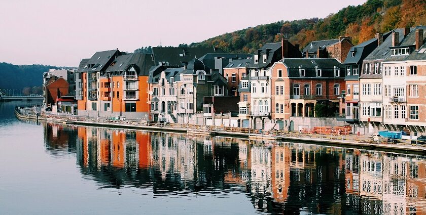 A view of the colourful houses near the lake - one of the places to visit in Belgium.