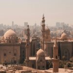 An aerial view of the Egyptian capital, Cairo, featuring a few buildings with domes.