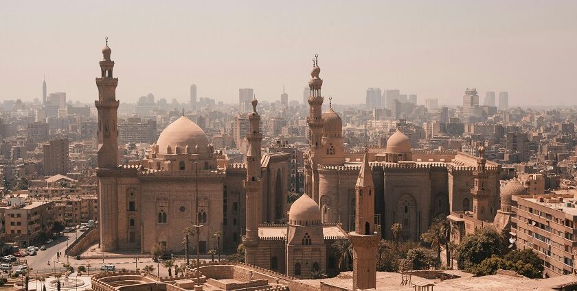 An aerial view of the Egyptian capital, Cairo, featuring a few buildings with domes.