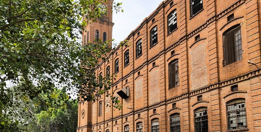 Image of a picturesque building and police man on a cycle - places to visit in Kanpur with friends