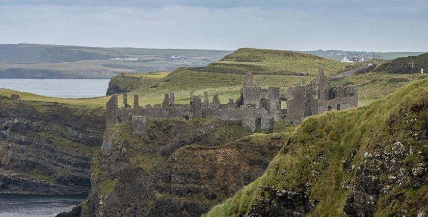 An Image of the Ruins of Dunluce Castle in Ballintoy, a must-see among the places to visit in Northern Ireland.