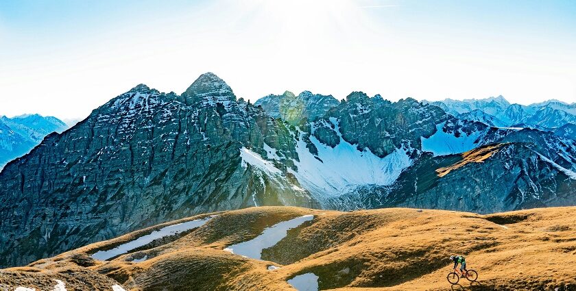 A panoramic view of Innsbruck, showcasing the old town, mountains, and alpine scenery.