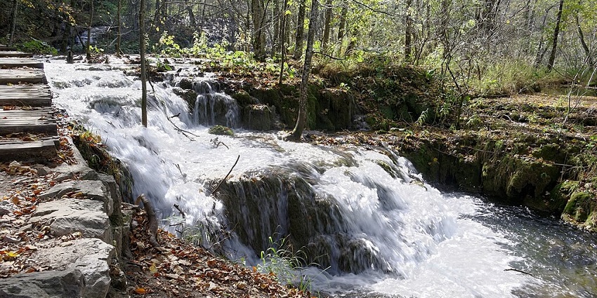 A scenic view of Plitvice Lakes National Park in Croatia, showcasing cascading waterfalls