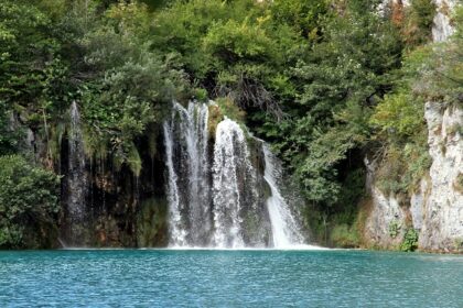 Plitvice Lakes National Park showcasing cascading waterfalls, and turquoise waters.