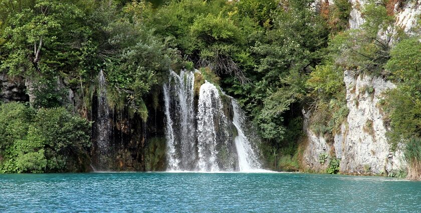 Plitvice Lakes National Park showcasing cascading waterfalls, and turquoise waters.