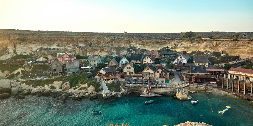 The scenery of Popeye Village under a clear sky, one of the best places to visit in Malta.