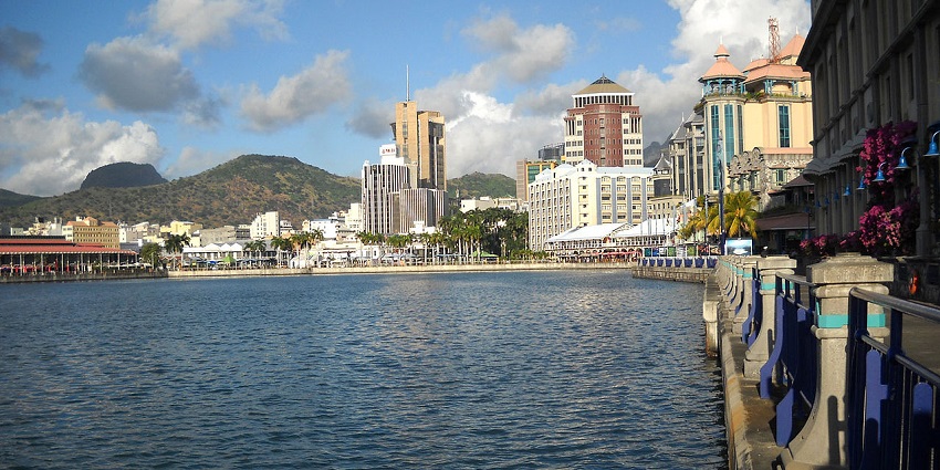 Port Louis waterfront with buildings and lamps, a place to celebrate valentine's day in Mauritius.