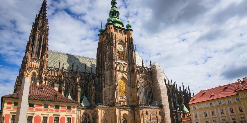Magnificent view of Prague Castle overlooking the Vltava River and city rooftops.