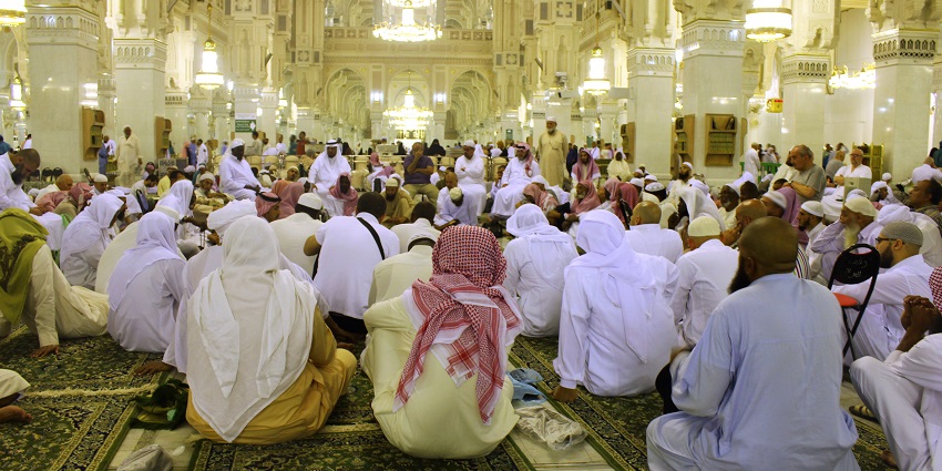 Spiritual experience praying within the grand Masjid al-Haram in Mecca, Saudi Arabia.