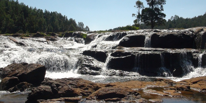 A wide view of flowing Pykara Waterfalls near Ooty, as mentioned in the Ooty travel guide.