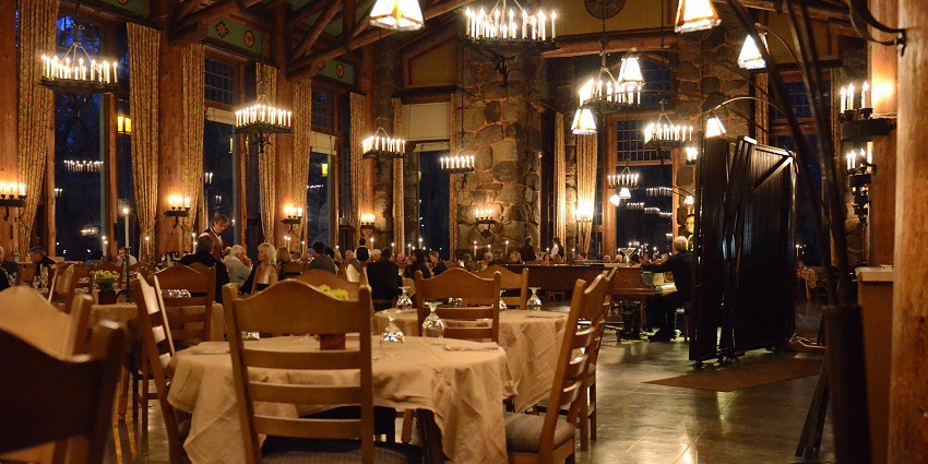 Restaurant filled with people and some empty tables and lights hanging from the ceiling
Viewers of this file can see comments and suggestions