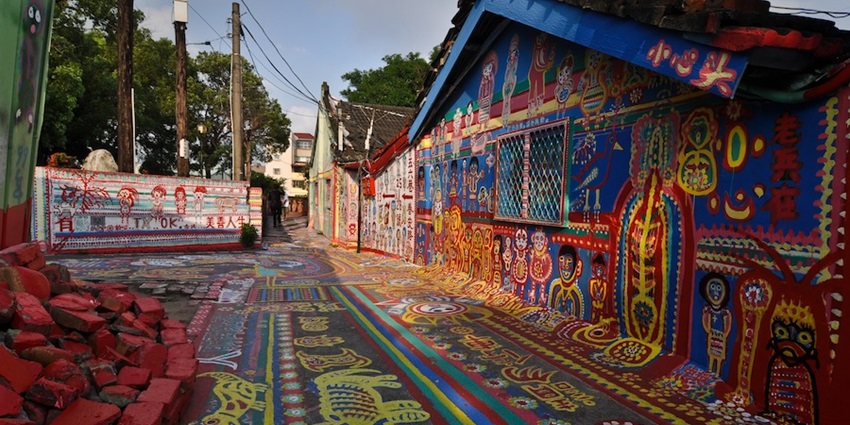 Vibrant village with colourful murals and creative artistic expressions