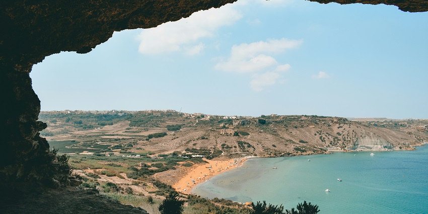 A wide view of Ramla Bay from a nearby cliff in Gozo, Malta, a breathtaking beach.