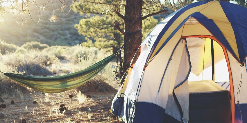 An image of a man in Rangeley Lake National Park, one of the best camping spots in Maine.