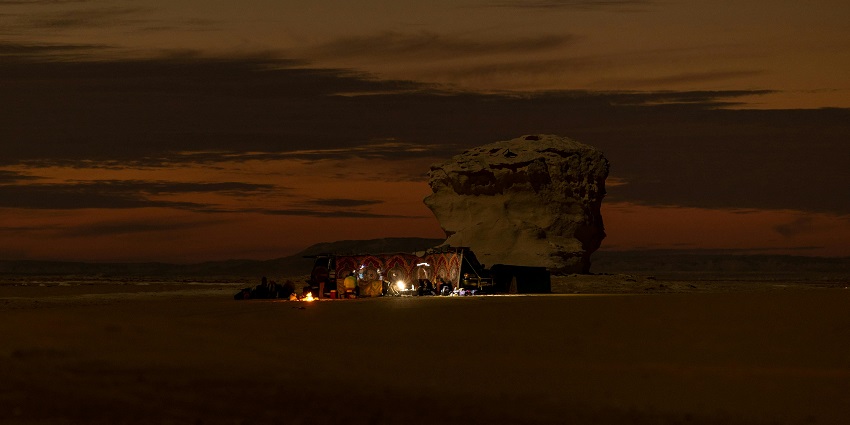 Travellers are relaxing at the campsite at Siwa Oasis, igniting fire during the nighttime