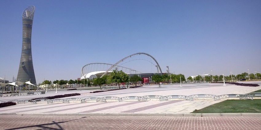 Spacious park with lake, gardens, and recreational areas.