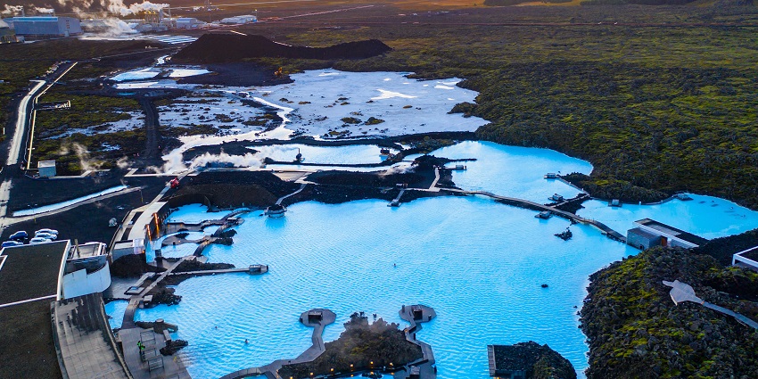 Aerial view of visitors enjoying the warm waters of the Blue Lagoon, a famous place in Iceland