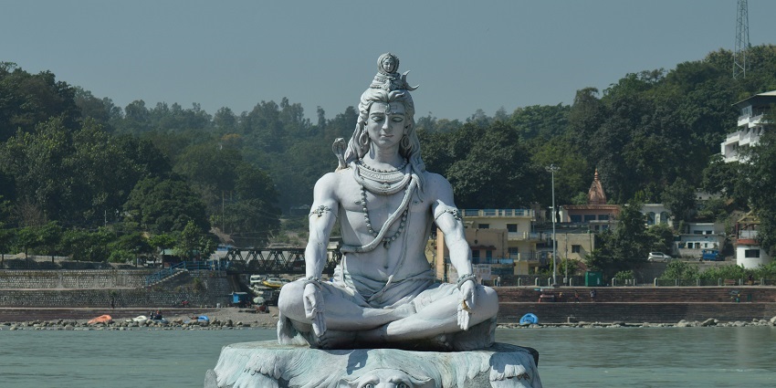 Image of lord shiva in Rishikesh near ganga body of water, Uttarakhand