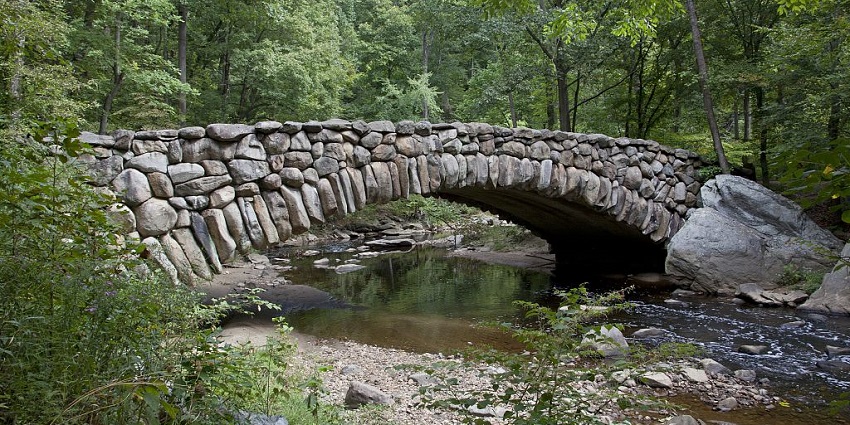 This image has a nature escape with the rocked bridge in this park which adds extra to the place
