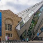 An image of an exterior view of the Royal Ontario Museum in the fall, showcasing modern architecture.