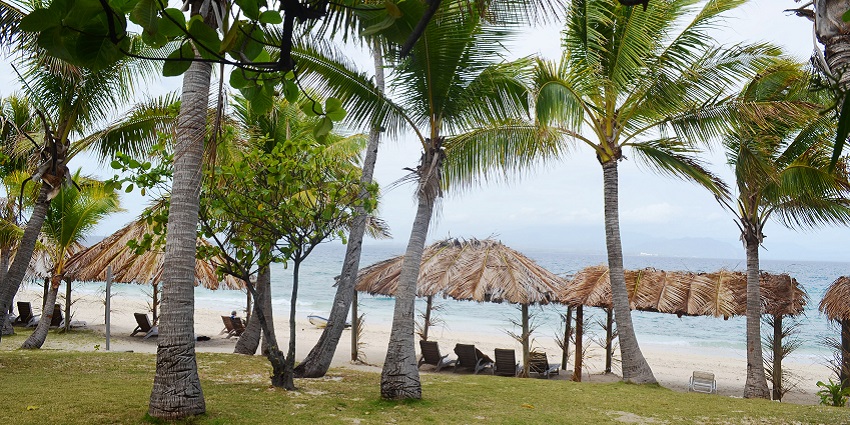 Chairs for tourists under traditional straw huts on one of the Mamanuca Islands, one of the best things to do in Fiji.
Viewers of this file can see comments and suggestions
