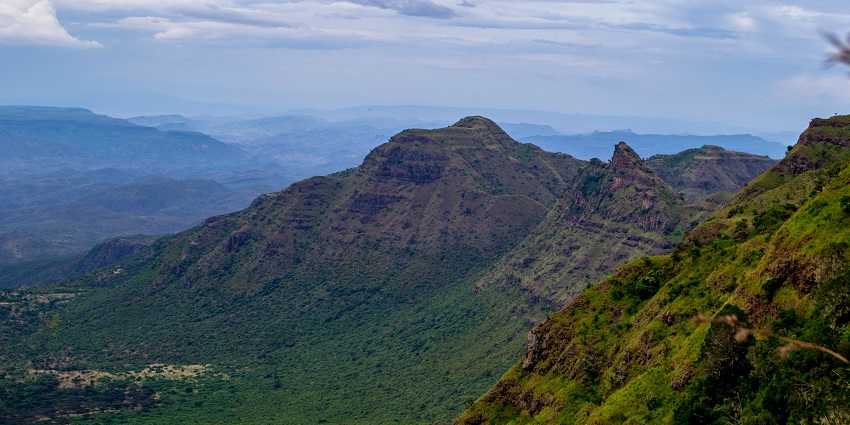 A serene view of the mountain peaks covered in green in Samburu National Reserve