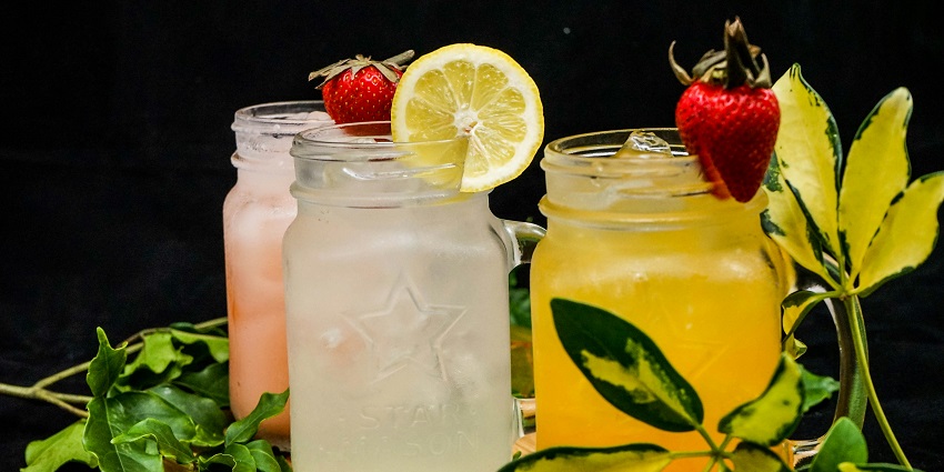 Image of a bar where drinks are decorated on the wall and glassed