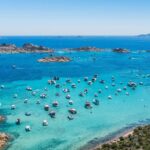 Sardinia travel guide highlights stunning beaches, ancient ruins, charming villages, and culture.