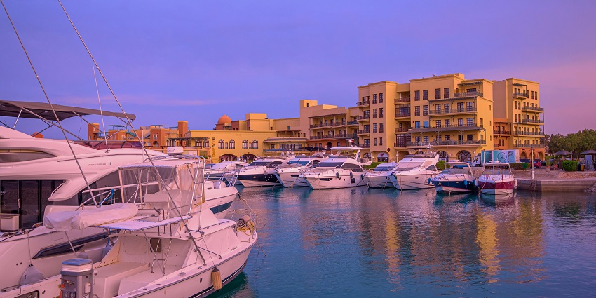 A few motorboats have been parked at a Marina in Hurghada during the time of sunset