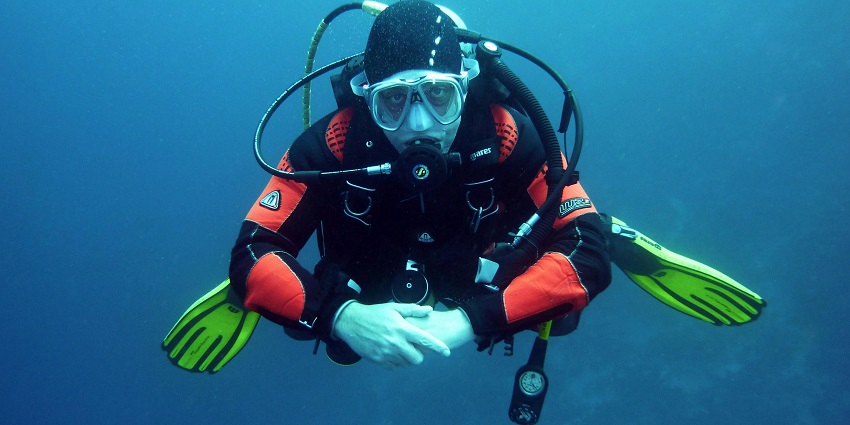 An image of a man enjoying Scuba Diving, one of the best water sports in Maharashtra.