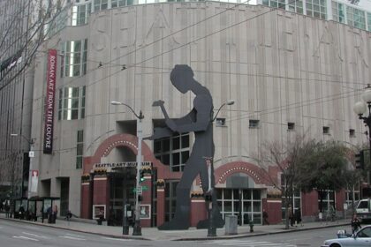 A picture of the Seattle Art Museum with modern architecture in contrast to the city skyline.