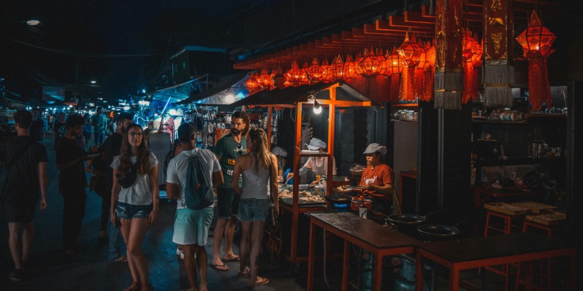An image of a vibrant night market that resembles the sector 104 market in noida