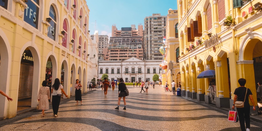 Group of people walking through the iconic Senado Square in China