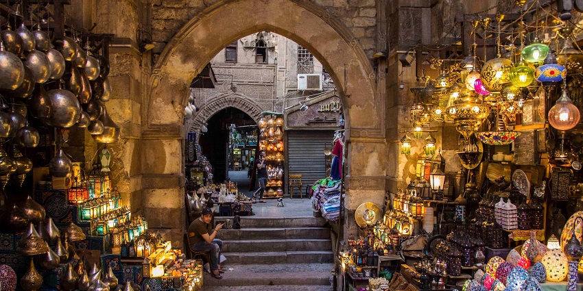 A vendor selling traditional Egyptian lamps at Khan El Khalili Bazaar.